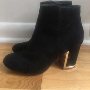 Black block heel booties with gold detail